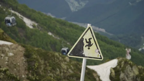 Warning sign on the top of mountain. Cable car with cabins Stock Footage 96234008