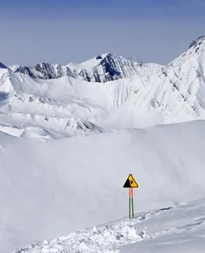 Warning sing on ski slope Stock Photos