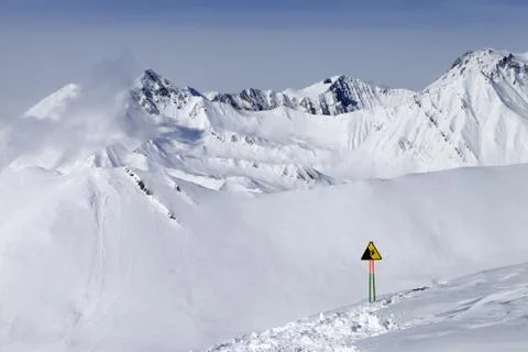 Warning sing on ski slope Stock Photos