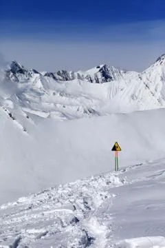 Warning sing on snow slope Stock Photos
