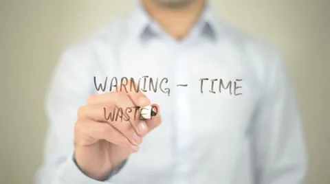 Warning - Time waster Ahead, man writing on transparent screen 스톡 동영상 62888609