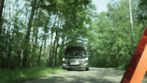 Warning Triangle. Car with Hazard Lights On Stock Footage