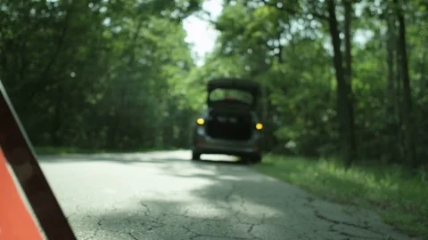 Warning Triangle. Car with Hazard Lights On Stock Footage