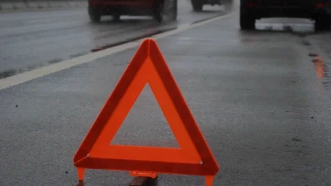 Warning triangle of car trouble on the highway Stock Footage 125903479