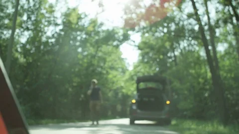 Warning Triangle. Man Walking and Talking on the Phone Stock Footage 79726729