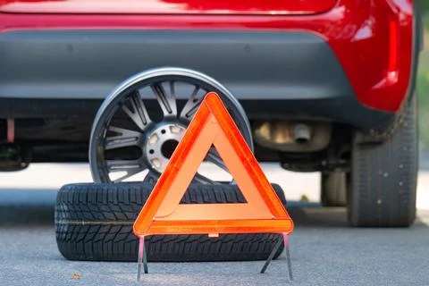 A warning triangle or breakdown triangle on a road. Photos