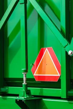 Warning triangle sign on agricultural machine 库存照片