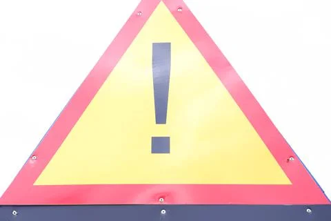 Warning triangular red and yellow hazard sign, taken outside and without Phot Stock Photos