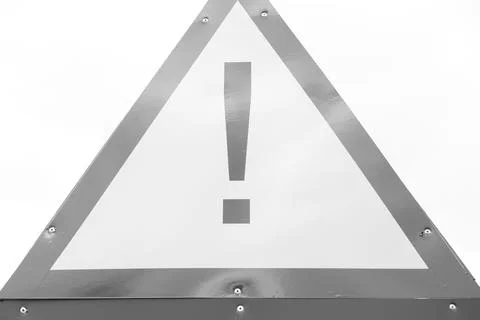 Warning triangular red and yellow hazard sign, taken outside and without Stock Photos