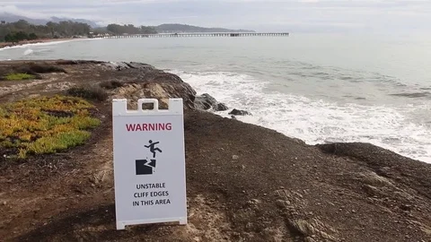 Warning of unstable cliffs at Goleta Beach Park, California - 2 views + audio Stock Footage 81006460