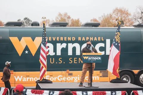 "Warnock" bus behind podium Stock Photos