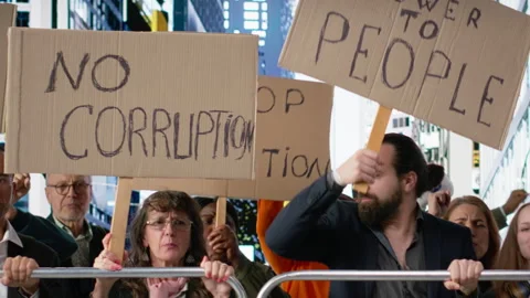Warring crowd of activists chanting against corruption and political misconduct Stock Footage 327421106