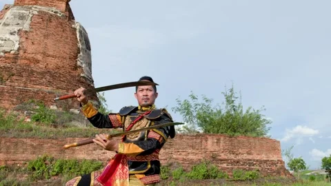 Warrior in Ancient Armor Performing Sword Martial Arts at Historical Ruins Stock Footage 341075911