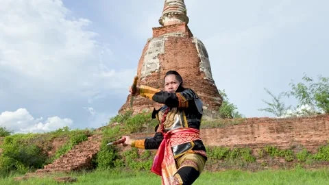 Warrior in Ancient Armor Practicing Sword Skills at Historical Temple Ruins Stock Footage 338319665
