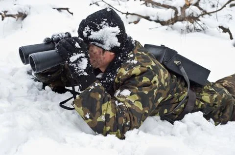 Warrior with binoculars on position.ambush.commando. Stock Photos