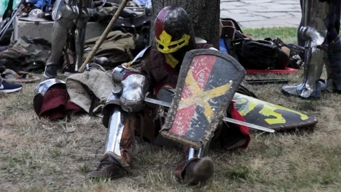 A warrior knight sits on the ground Stock Footage 120780183
