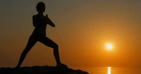 Warrior pose from yoga Stock Footage 106476041