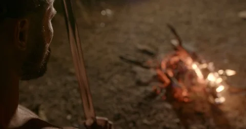 Warrior putting sword in fire Stock Footage 127170727