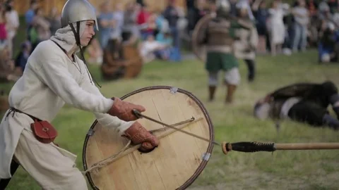 Warrior with a shield fights off a spearman Stock Footage 82359502