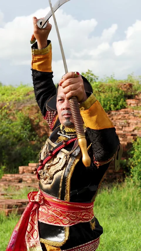 Warrior in Traditional Costume Performing Sword Martial Arts at Ancient Ruins Stock Footage 339870093