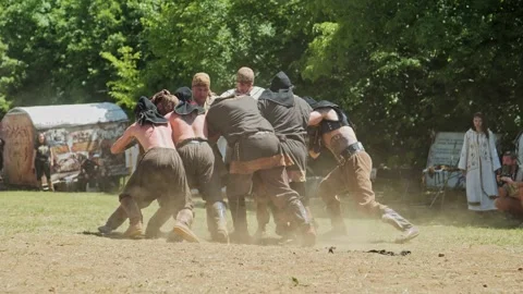 Warriors demonstrate ancient battle strength fighting at Bulgarian festival Stock Footage 192880567