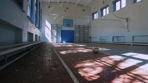 War's impact: broken windows and debris in a Ukrainian school after an attack. Stock Footage 329972765