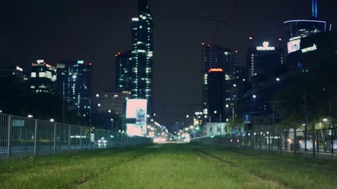 Warsaw City centre during night time, looking from the green patch. Stock Footage