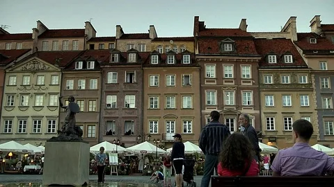 Warsaw old town market square in evening panning shot Stock Footage