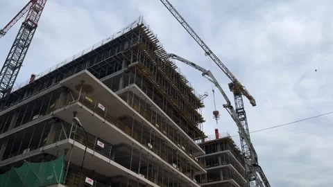 Warsaw, Poland - May 01, 2024 Movement of cranes during construction of house in Stock Footage 274826341