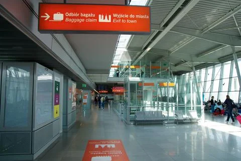 Warsaw, Poland, May 10 2018: Airport terminal corridor with gate signage Stock Photos