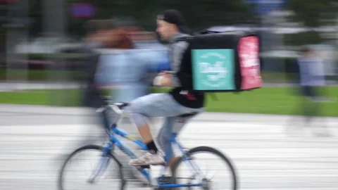 WARSAW, POLAND - SEPTEMBER 14, 2017. Bicycle food delivery courier Stock Footage