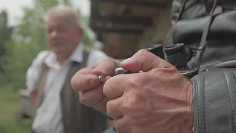 Warsaw Uprising reenactor loading pistol magazine close up Stock Footage 339203161