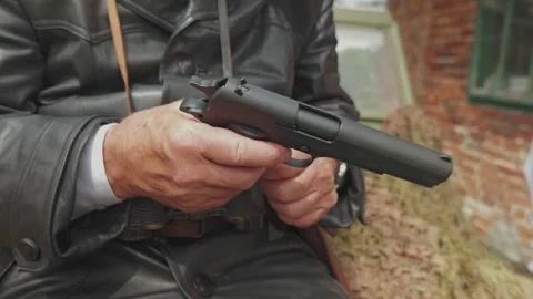 Warsaw Uprising reenactor loading Vis wz. 35 pistol Stock-Footage 339203940