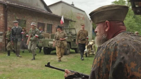 Warsaw Uprising reenactor securing area with rifle Stock-Footage 339204281