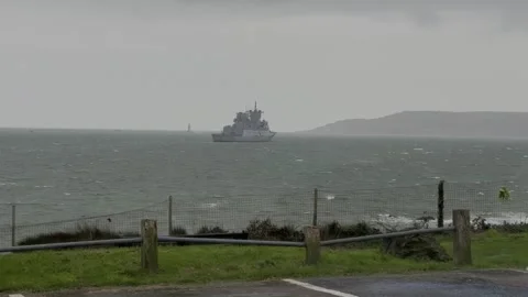 Warship navigating rough seas on a stormy day Stock Footage 331252024