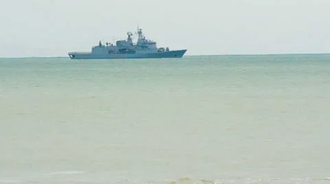 Warship sails over the sea horizon 01 Stock Footage