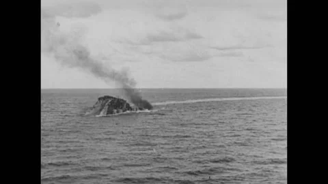 Warship sinking and exploding into the ocean, 1940s 库存影片 260257325
