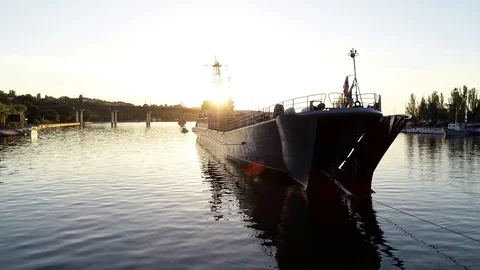 Warship on the sunset river Stock Footage 103426728