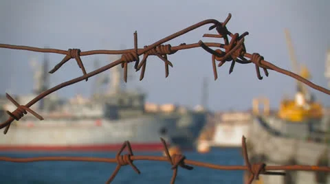 Warships behind barbed wire. Stock Footage 27210930