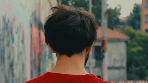 Wary boy with Cigarette Turns Around Stock-Footage 87200747