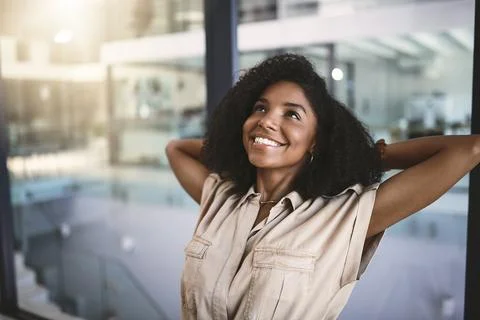 That was some of my best work. a happy young businesswoman relaxing at her desk Stock Photos