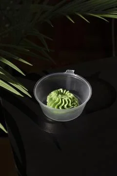 Wasabi in Small Plastic Container Stock Photos