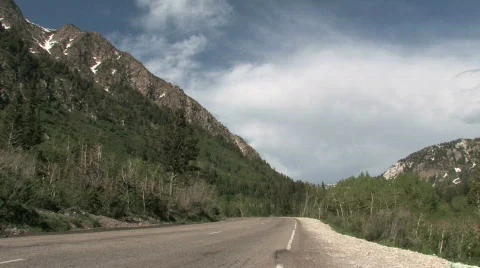Wasatch Mountain Utah road cars away M HD Stock Footage
