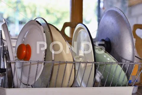 Wash-up and drying kitchenware Stock Photos