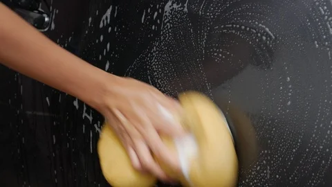 Wash car by hand with sponge Stock Footage