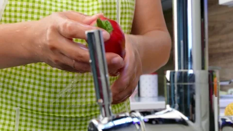 Wash different vegetables under the tap. Video stock 84432663