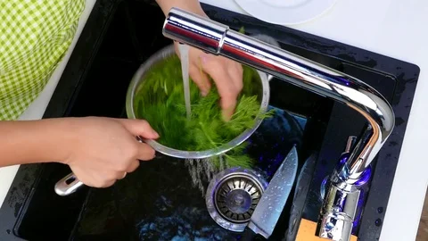 Wash the dill under the tap. Stock Footage 84444365