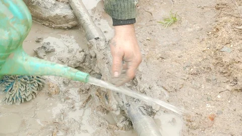 Wash the drill bit from clay Stock Footage 105676397