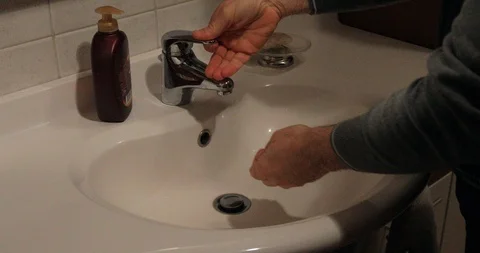 Wash hands in the bathroom Stock Footage 87689731