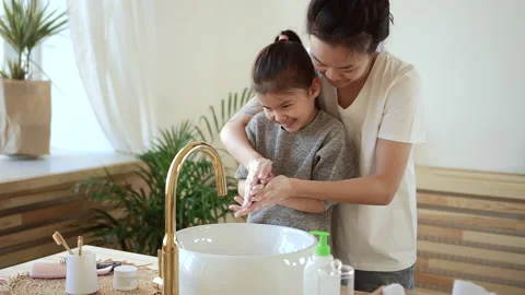 Wash hands routine procedure mum helps girl clean palms Spbd Stock-Footage 160807623